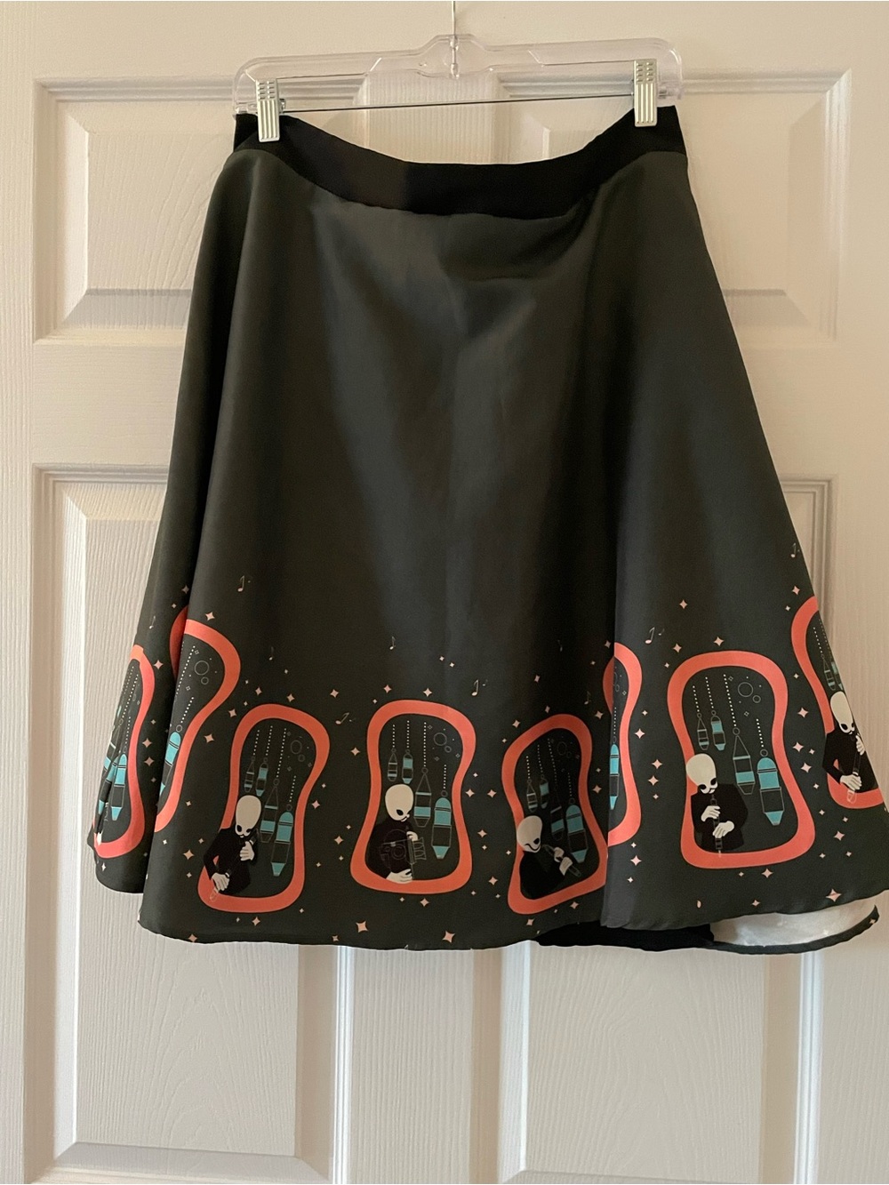 Her Universe Black Skater Skirt with Coral & Teal Retro Border